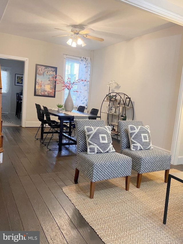 dining space featuring ceiling fan and dark hardwood / wood-style flooring