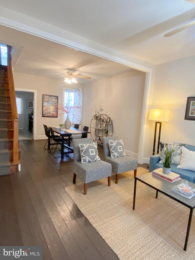 living room with hardwood / wood-style flooring and ceiling fan