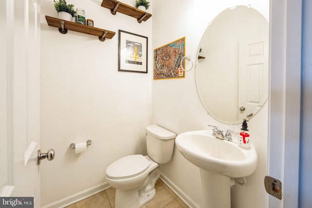 bathroom with tile patterned flooring and toilet