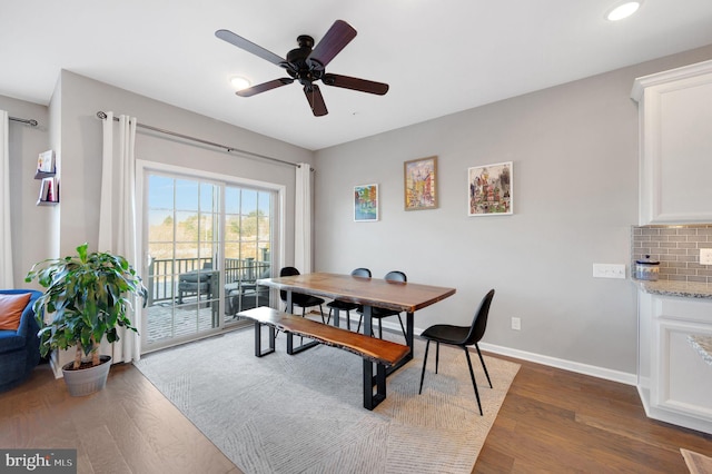 dining room featuring ceiling fan and hardwood / wood-style flooring