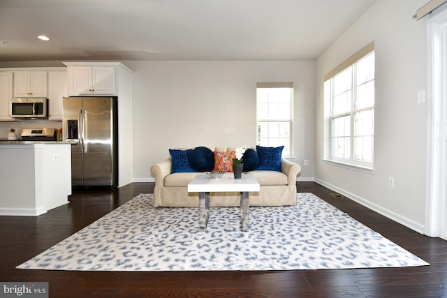 living room with dark hardwood / wood-style floors