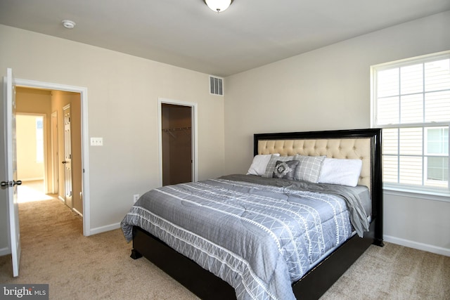 carpeted bedroom featuring a closet