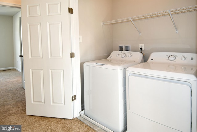 washroom featuring light colored carpet and independent washer and dryer