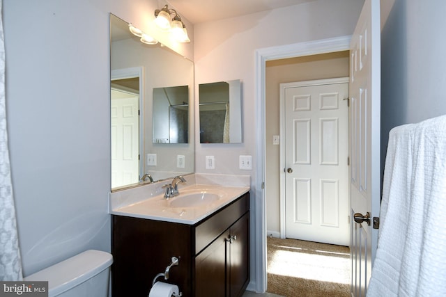 bathroom with vanity and toilet