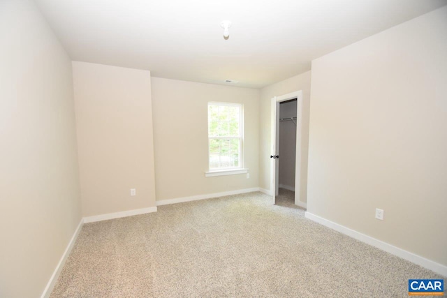 unfurnished room with light carpet