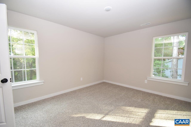 spare room featuring carpet floors