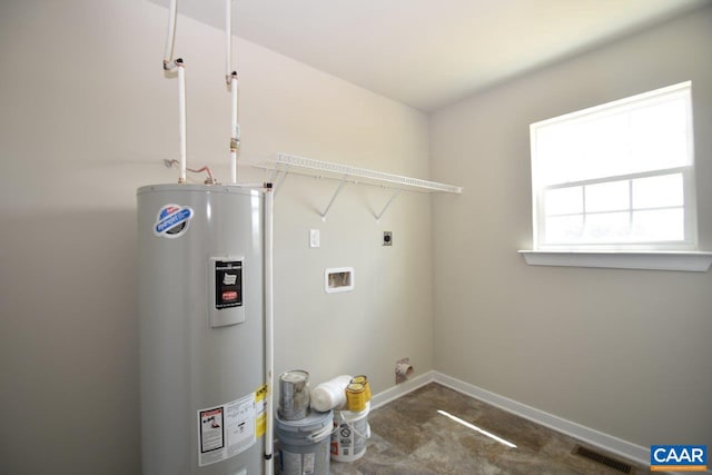 clothes washing area with electric dryer hookup, water heater, and washer hookup