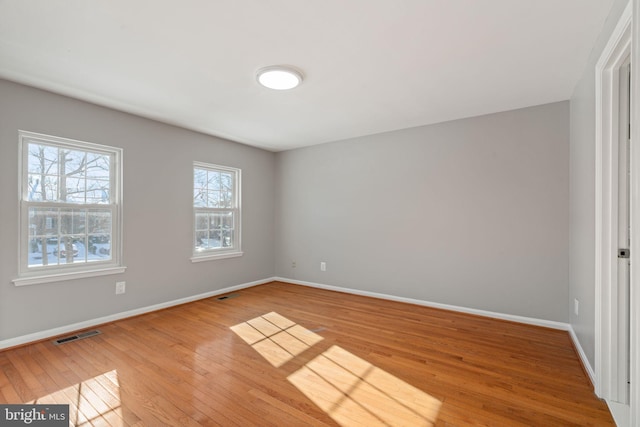 empty room with wood-type flooring