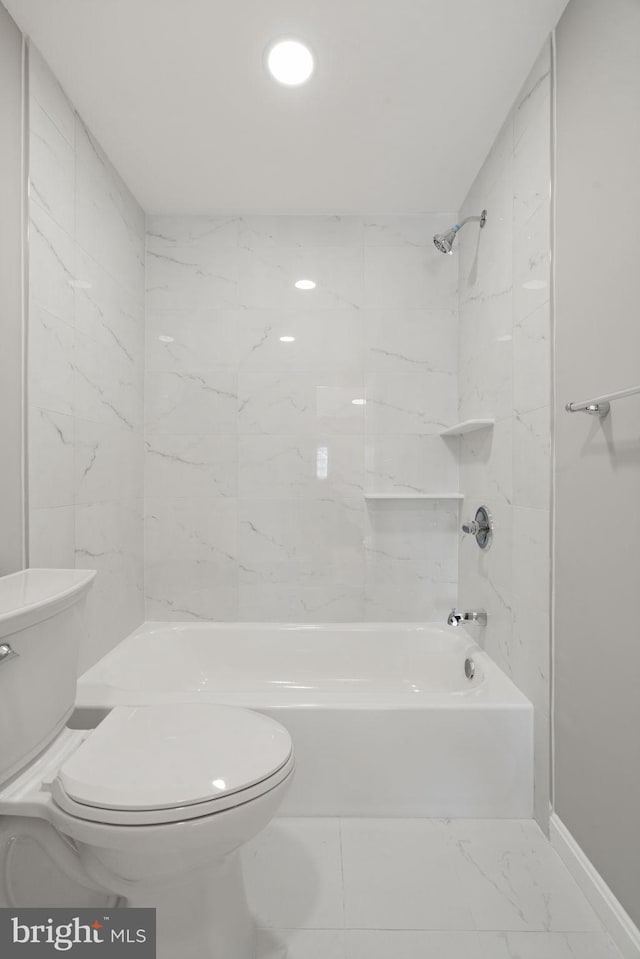 bathroom with toilet and washtub / shower combination