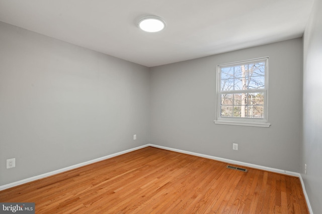 unfurnished room featuring light hardwood / wood-style flooring