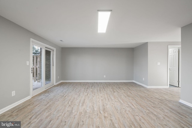 spare room featuring light hardwood / wood-style flooring