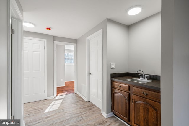 bathroom featuring vanity and hardwood / wood-style flooring