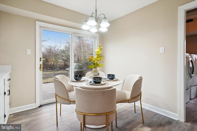 dining room featuring a chandelier, wood finished floors, and baseboards