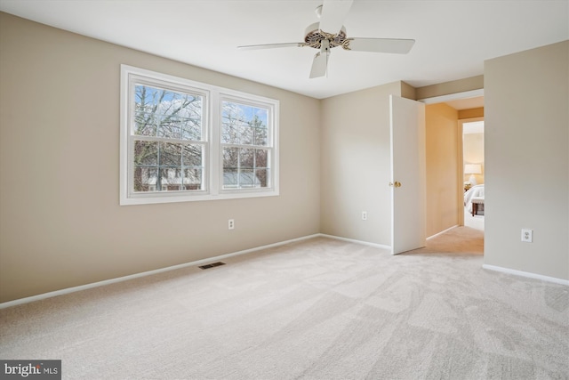 unfurnished bedroom featuring ceiling fan, carpet flooring, visible vents, and baseboards