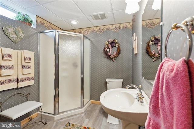 bathroom featuring hardwood / wood-style flooring, sink, a paneled ceiling, and an enclosed shower