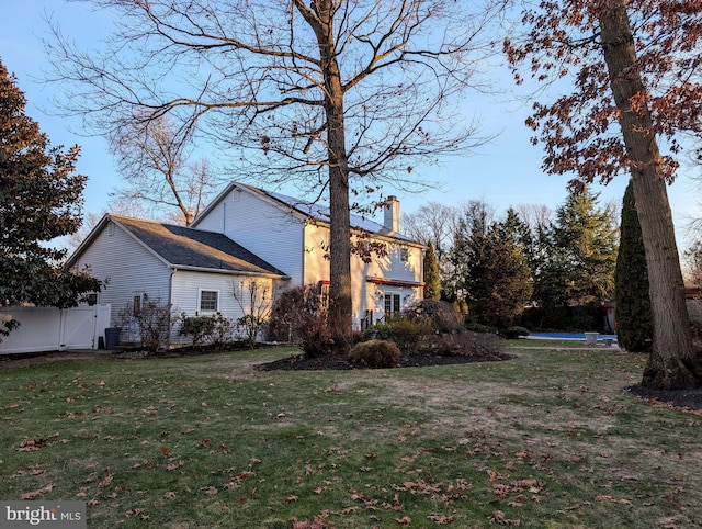 view of property exterior featuring a yard