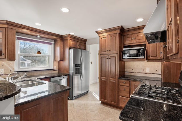 kitchen with island exhaust hood, light tile patterned floors, stainless steel appliances, a sink, and dark stone counters