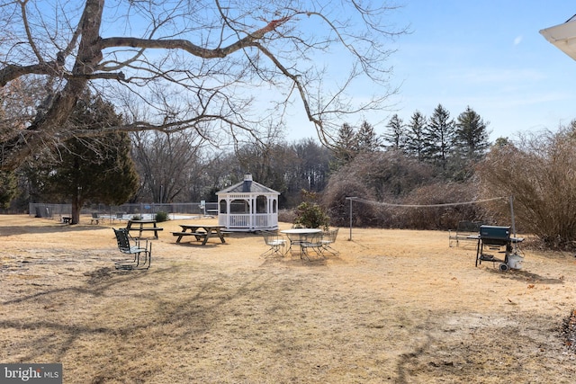 surrounding community featuring a gazebo and fence