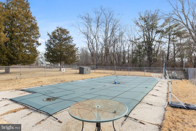 view of swimming pool featuring fence and a fenced in pool