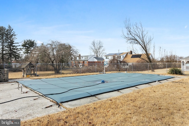 view of pool with a lawn, fence, and a fenced in pool