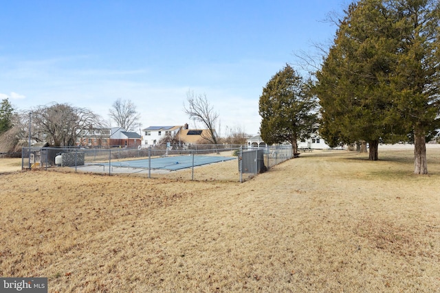 view of pool featuring fence, a fenced in pool, and a yard