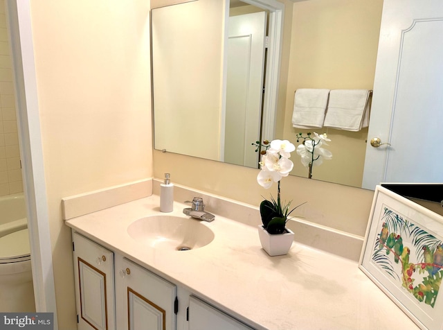 bathroom with vanity and toilet