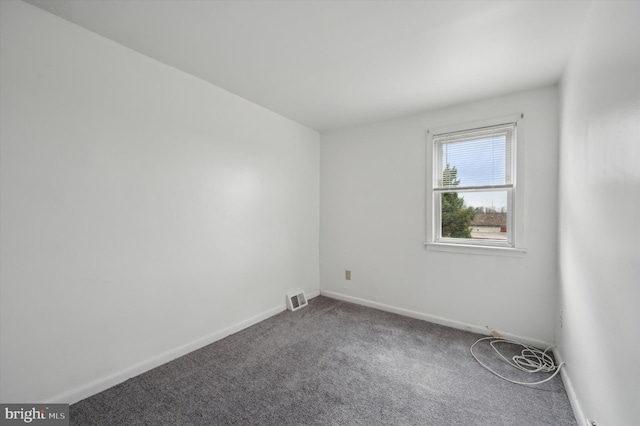 spare room featuring carpet flooring