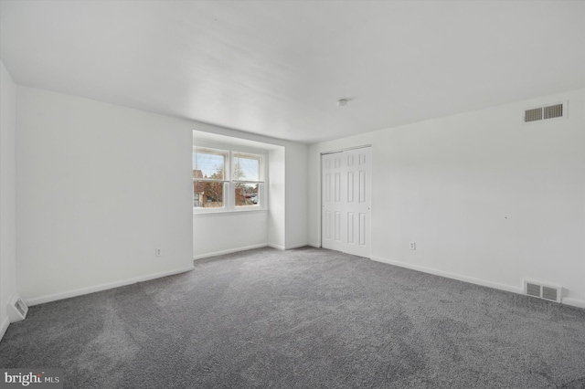 unfurnished room with carpet floors