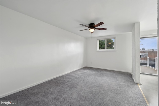 spare room with carpet and ceiling fan