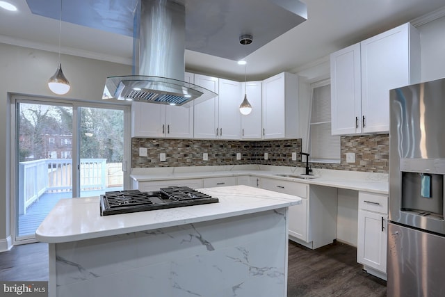 kitchen featuring white cabinetry, island exhaust hood, stainless steel appliances, sink, and light stone counters