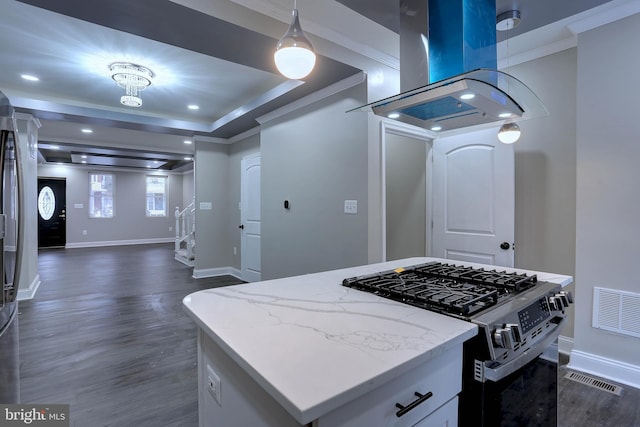 kitchen featuring gas stove, a kitchen island, light stone countertops, white cabinets, and island range hood