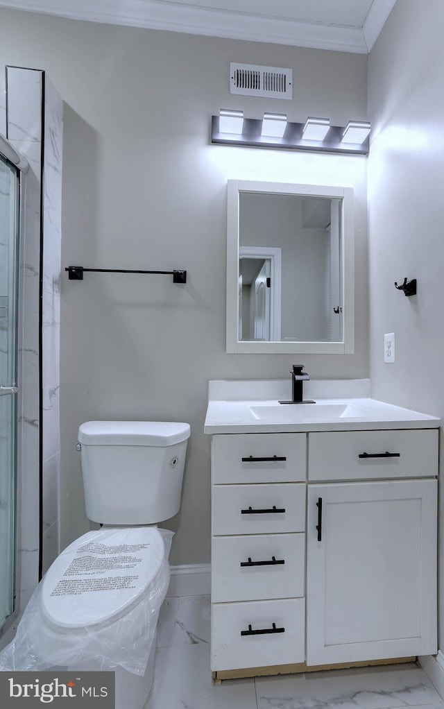 bathroom featuring toilet, ornamental molding, an enclosed shower, and vanity