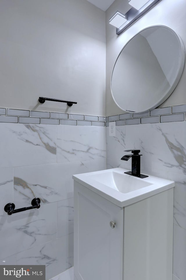 bathroom featuring tile walls, backsplash, and vanity