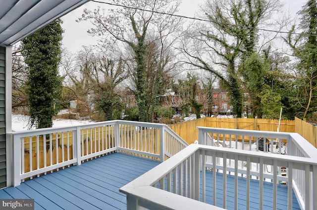 wooden deck featuring a swimming pool