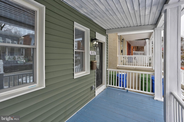 wooden terrace featuring a porch