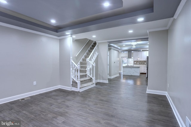 interior space with stainless steel fridge, dark hardwood / wood-style flooring, and crown molding