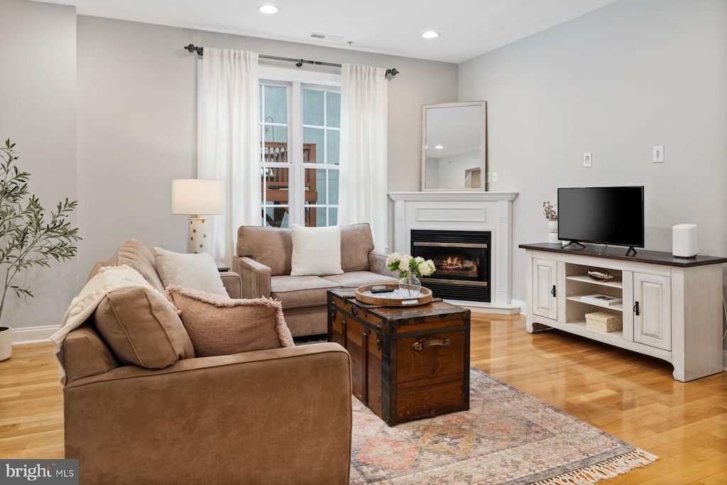 living room with light hardwood / wood-style floors