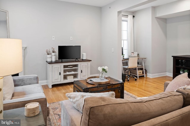 living room with light hardwood / wood-style floors