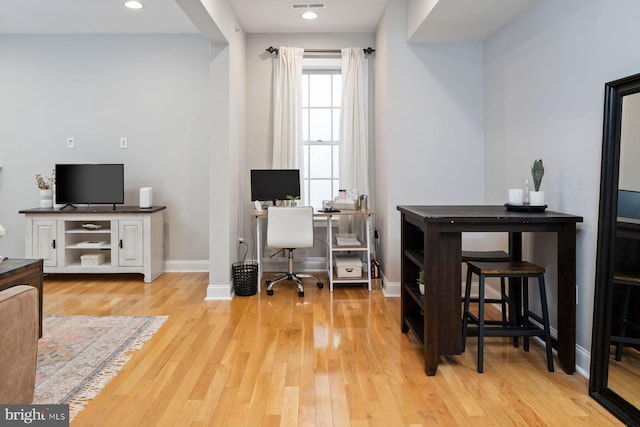 office space with light hardwood / wood-style flooring