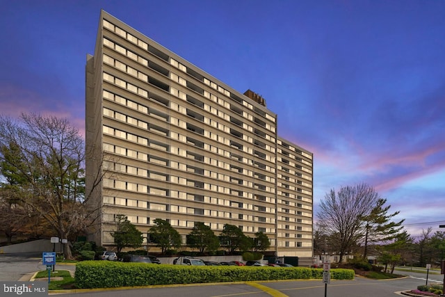 view of outdoor building at dusk