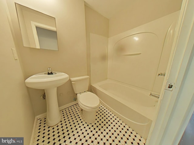 bathroom with shower / tub combination and toilet