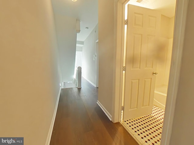 hall with dark hardwood / wood-style flooring