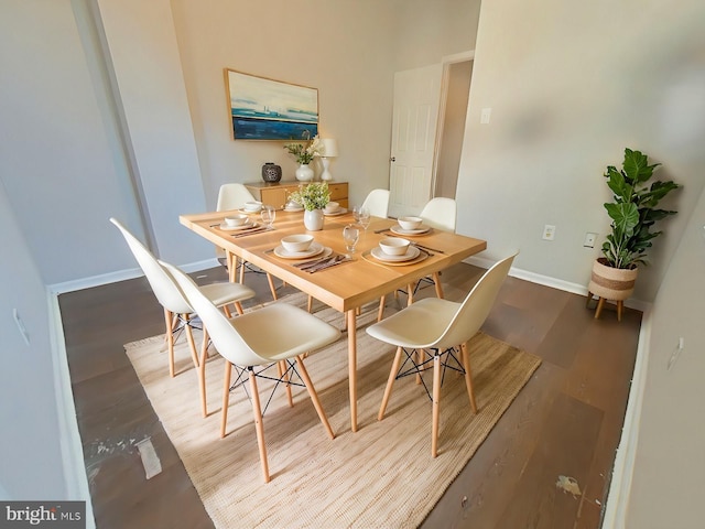 dining area with hardwood / wood-style flooring