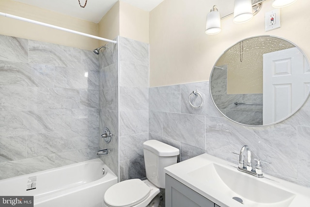 full bathroom with decorative backsplash, vanity, tile walls, toilet, and tiled shower / bath