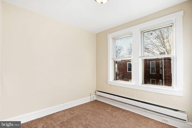 empty room with carpet floors and a baseboard radiator