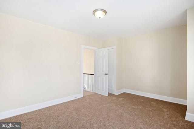 empty room featuring carpet floors