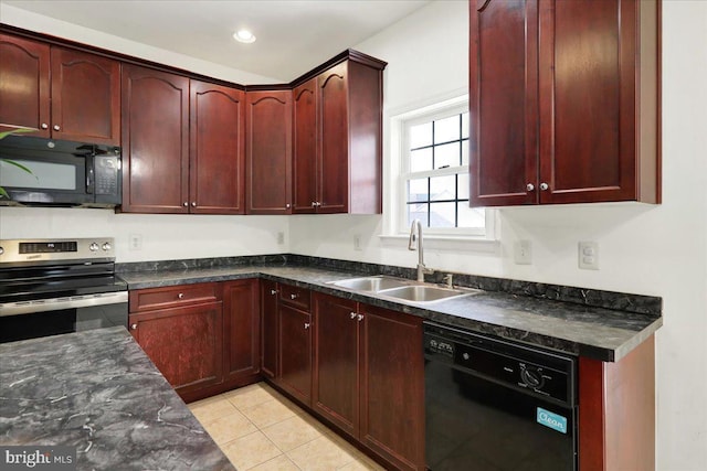 kitchen with light tile patterned floors, sink, dark stone countertops, and black appliances