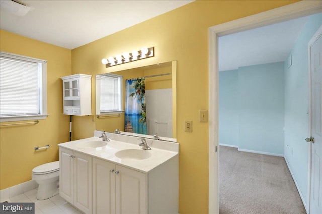 bathroom with tile patterned flooring, vanity, toilet, and a shower with shower curtain