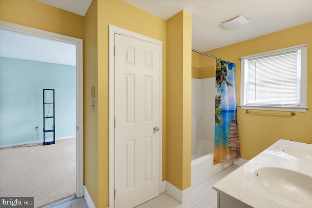 bathroom with tile patterned flooring, vanity, and shower / bath combo with shower curtain