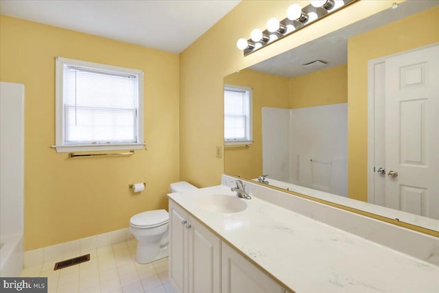 bathroom featuring vanity, toilet, and walk in shower